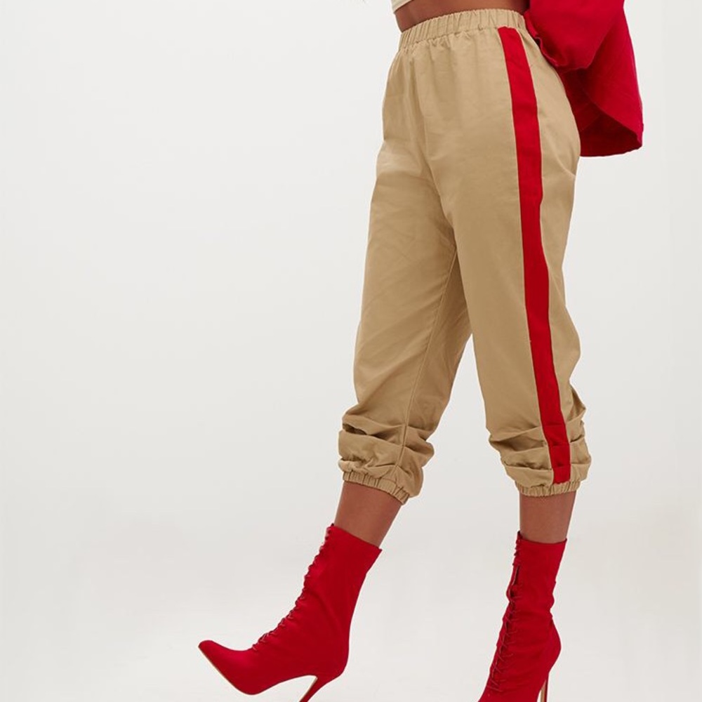 Stone colored pants red stripe contrast
